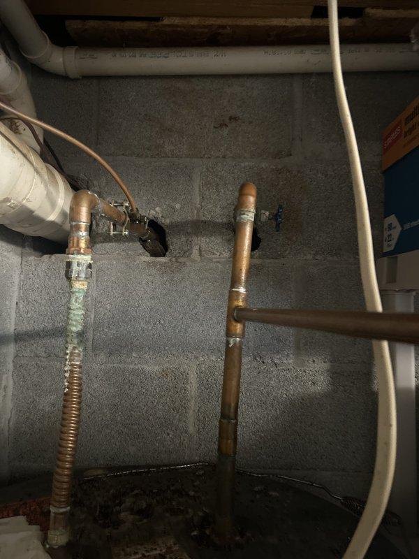 Responded to no hot water complaint on 10-year-old Mor-Flo tank water heater connected to geothermal system. Upon inspection, diagnosed failed heating element and thermostat malfunction preventing proper water heating while geothermal cooling system continued normal operation. Replaced defective upper heating element, installed new thermostats, flushed sediment buildup from tank, and verified all plumbing connections and pressure relief valve for proper operation. Restored hot water supply to full functionality and confirmed system returned to normal operating temperature.