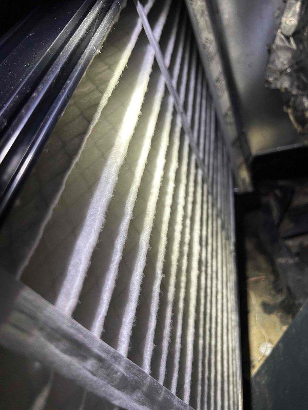Completed seasonal air conditioning maintenance as part of care plan agreement. Performed comprehensive system inspection including evaporator coil assessment, ductwork temperature diagnostics, and airflow evaluation. Customer-supplied filter will be changed during spring service visit per maintenance agreement. Documentation photos captured showing insulated ductwork with temperature readings and evaporator coil condition with visible debris accumulation on fins, indicating normal wear between service intervals.