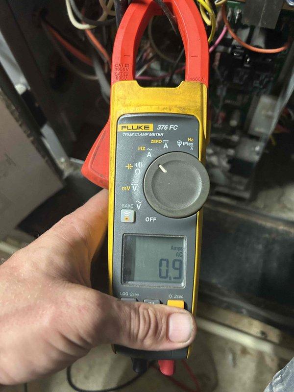 Responded to no cooling complaint on 15-year-old residential air conditioning system. Upon arrival, confirmed indoor blower motor operating but no cool air delivery throughout home. Performed system diagnostics including amperage draw testing on outdoor unit using clamp meter, which revealed minimal current draw indicating compressor failure to engage. Inspection of indoor evaporator coil and drain pan showed significant sediment accumulation and standing water with debris, indicating inadequate drainage and lack of routine maintenance. Identified failed compressor and/or associated electrical components as root cause of no cooling condition. Due to age of system and extent of deferred maintenance, provided customer with repair versus replacement options and recommendations for 15-year-old equipment.