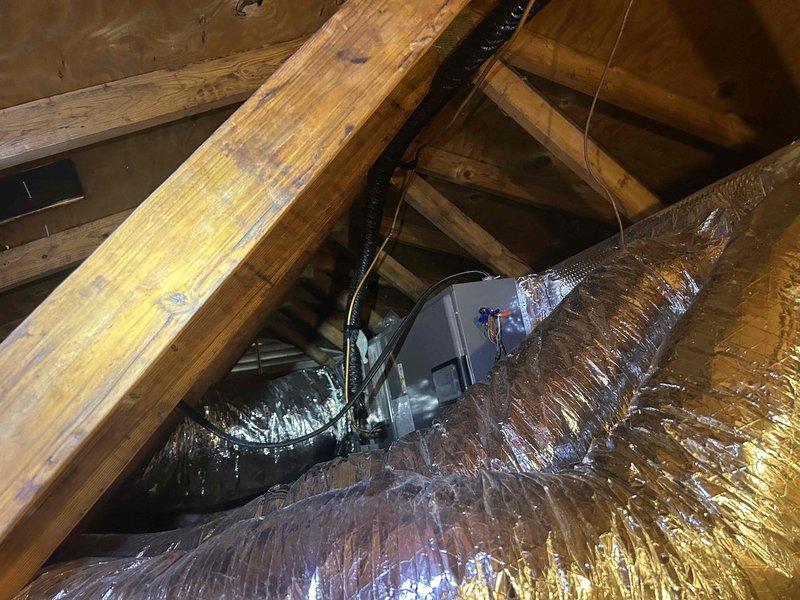 Completed one-time visual inspection of 2-year-old heat pump system per customer request. Accessed attic-mounted indoor air handler unit and inspected ductwork installation, insulation integrity, and overall system condition. Documented temperature readings and verified proper installation of metallic flex ductwork with reflective insulation barrier, confirming all components are functioning within normal parameters with no immediate service needs identified.
