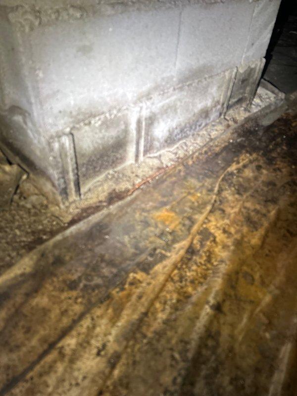 Completed comprehensive AC tune-up on residential system in home over 30 years old. Upon inspection, discovered evaporator coil heavily frozen with significant ice buildup, indicating restricted airflow or refrigerant issue. Documented severely stained drain pan showing extensive corrosion, mineral deposits, and biological growth from prolonged moisture exposure. Measured system pressures and electrical parameters using manifold gauges and digital multimeter to diagnose freezing condition. Identified need for immediate follow-up to address coil freezing issue, dirty evaporator coil, compromised drain pan, and potential airflow restrictions before system can operate efficiently.