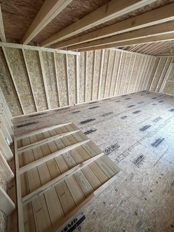 Completed electrical installation in new construction outbuilding, including installation of 100-amp main electrical panel with two circuit breakers, one GFCI receptacle, two duplex receptacles, one single-pole switch, and two keyless light fixtures. All wiring and devices installed per code requirements in the unfinished structure with exposed OSB sheathing and structural framing.