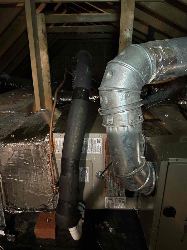 Responded to callback for recently installed AC system experiencing third shutdown since installation. Upon inspection in attic space, confirmed previous technician's assessment that condensate drain line was improperly sized and installed too short, causing drainage issues and triggering safety float switch. Removed inadequate drain line and reinstalled with proper length PVC piping, ensuring correct pitch and secure connections to air handler. Verified condensate flow, tested system operation through complete cooling cycle, and confirmed unit running properly without shutdown. System now operating as designed with no further drainage concerns.