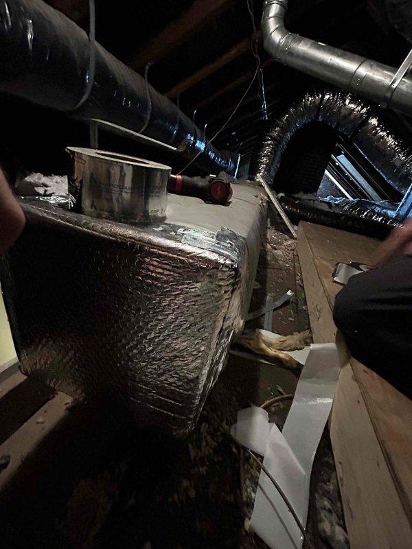 Completed attic ductwork repair utilizing two technicians over a four-hour period. Installed six sheets of double joist panning metal to properly cap and seal exposed ductwork sections. Applied foil-backed insulation to air handler unit and associated ductwork to improve thermal efficiency and prevent condensation issues in the attic space.