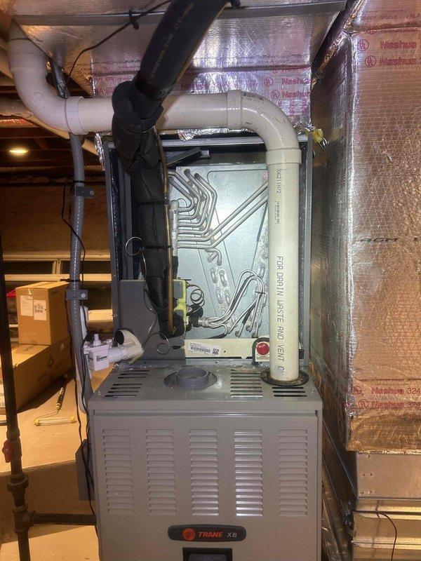 # HVAC Service Report

Responded to no cooling complaint on 3-year-old air conditioning system. Upon arrival, noted customer reported recent refrigerant addition by another service provider. Performed comprehensive system diagnostic including refrigerant charge verification, electrical component testing, and airflow assessment.

Inspection revealed evidence of refrigerant leak at evaporator coil connection points, indicated by oil staining on coil housing and drain pan. Used electronic leak detector to confirm active leak at brazed joint. System was operating with insufficient refrigerant charge despite recent service, explaining inadequate cooling performance.

Documented leak location with photos showing stained components and affected areas. Discussed repair options with customer including leak repair and proper refrigerant recharge versus coil replacement. Provided detailed estimate for permanent repair to address root cause of cooling failure. System was shut down to prevent compr