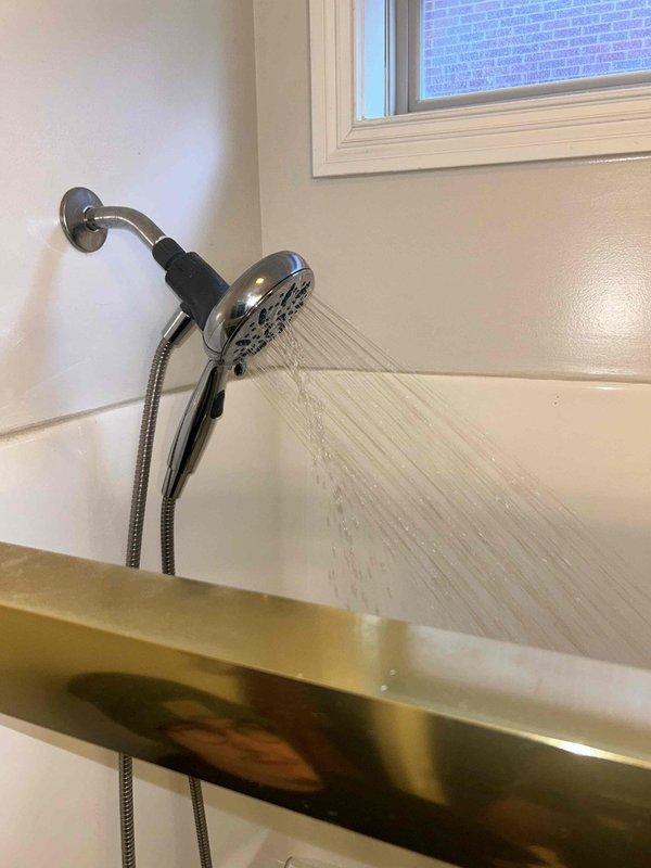 Completed routine plumbing preventative service assessment for residential property. Inspected kitchen sink drain assembly including P-trap, slip-joint connections, and flexible tailpiece for proper operation and potential leaks. Examined bathroom shower system including dual showerhead fixture, wall-mounted arm, handheld spray unit with flexible metal hose, and verified proper water flow and spray patterns. All plumbing fixtures found to be functioning properly with no immediate repairs required.