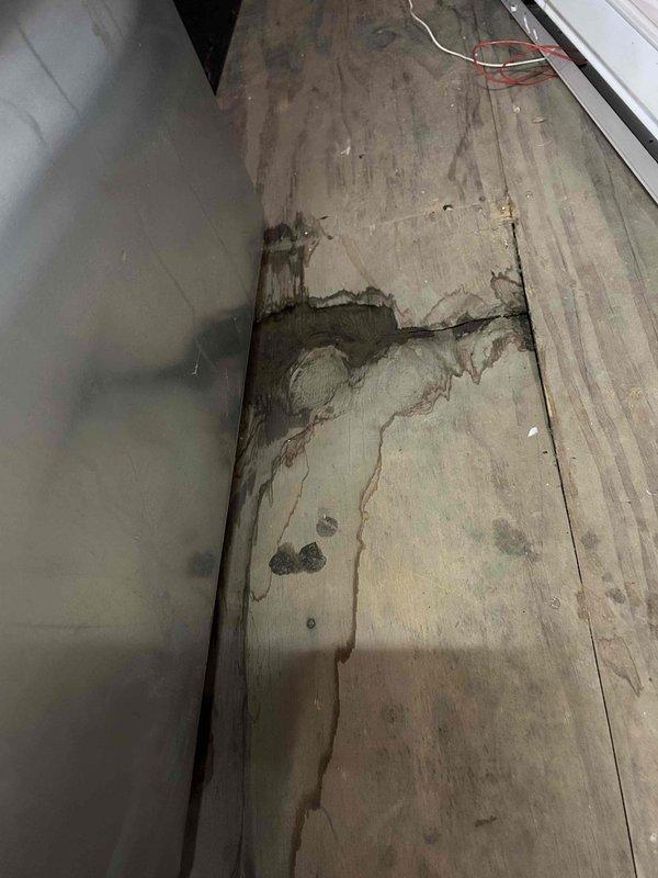 Responded to callback for persistent water leak from upstairs air handler causing significant water accumulation in basement below. Upon inspection, found improperly installed condensate drain system with inadequate P-trap configuration allowing water to bypass drainage path and leak onto floor. Disassembled existing PVC drain assembly, removed defective components, and reinstalled proper condensate drain piping with correctly configured P-trap to ensure proper drainage and prevent future leaks. Verified system operation and confirmed no active leaking from unit or drain connections.