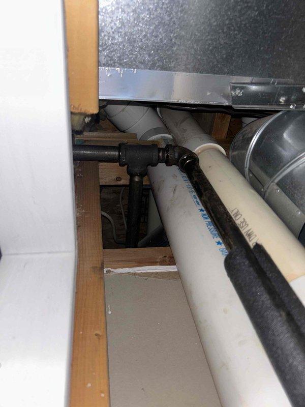 # Water Heater Gas Ignition Repair

Responded to service call for Rheem Performance tanked water heater with reported gas odor and ignition failure. Gas utility company had previously identified the water heater as the source and confirmed flame would not light. Upon inspection, diagnosed faulty ignition system preventing burner from lighting properly.

Performed complete diagnostic evaluation of gas control valve, thermocouple, and ignition assembly. Identified malfunctioning pilot assembly causing ignition failure and gas odor concern. Replaced defective pilot assembly and tested all safety controls to ensure proper operation. Verified gas connections for leaks using approved leak detection solution. Confirmed proper combustion air supply to power vent system and inspected PVC exhaust venting for obstructions or damage.

Cycled unit through multiple heating cycles to verify reliable ignition and proper burner operation. Tested temperature and pressure relief valve for proper function