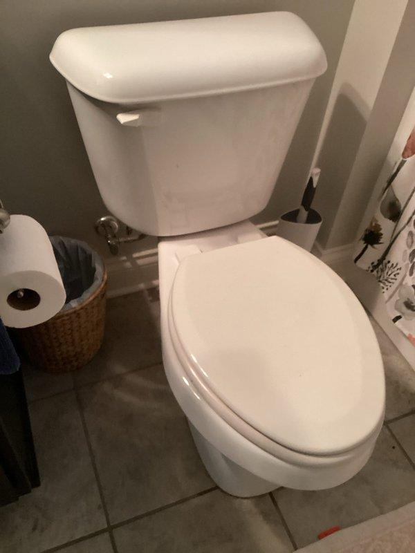 Responded to a continuously running toilet in a 13-year-old residential property. Upon inspection, removed the tank lid and identified a deteriorated flapper valve that was no longer sealing properly against the flush valve seat, allowing water to leak from the tank into the bowl. Replaced the worn black rubber flapper with a new unit and adjusted the fill valve to ensure proper water level. Tested the flush mechanism multiple times to confirm the toilet now fills and shuts off correctly without continuous running. System is operating within normal parameters.