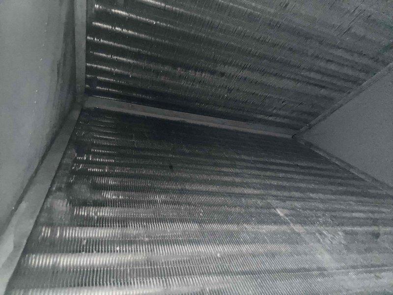 Responded to no cooling complaint on 2-year-old residential AC system that was frozen up and not operating. Upon inspection, found severely clogged air filter restricting airflow, which caused evaporator coil to freeze. Removed and replaced dirty filter, allowed system to thaw completely, and verified proper airflow through evaporator coil. System returned to normal cooling operation with adequate airflow restored.