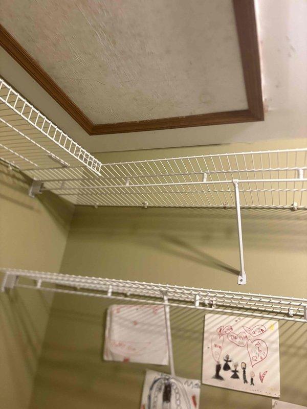 Completed full HVAC system installation on second floor of residential property. Installed RUUD 50K BTU 80% efficiency gas furnace (Model R801T0503A14UHSNAS), RUUD 2.5-ton air conditioning condenser unit (Model RA14AY30AJ1NALHP), RUUD evaporator coil (Model RCFY3617STANMC), and digital thermostat. 

Installation included outdoor unit pad, electrical whip kit, electrical disconnect box, refrigerant line insulation, refrigerant line filter drier, and SS2 coil drain safety water sensor. Transitioned evaporator coil to existing ductwork and installed standard-sized air filter rack. Connected furnace to flue piping with proper venting. Installed electrical shut-off switch and gas shut-off valve for safety compliance. 

Constructed code-compliant platform using plywood and boards to provide proper walkway and equipment support in confined installation space. Utilized ductboard materials for necessary ductwork modifications and transitions. Routed flexible aluminum ductwork to air handler wit