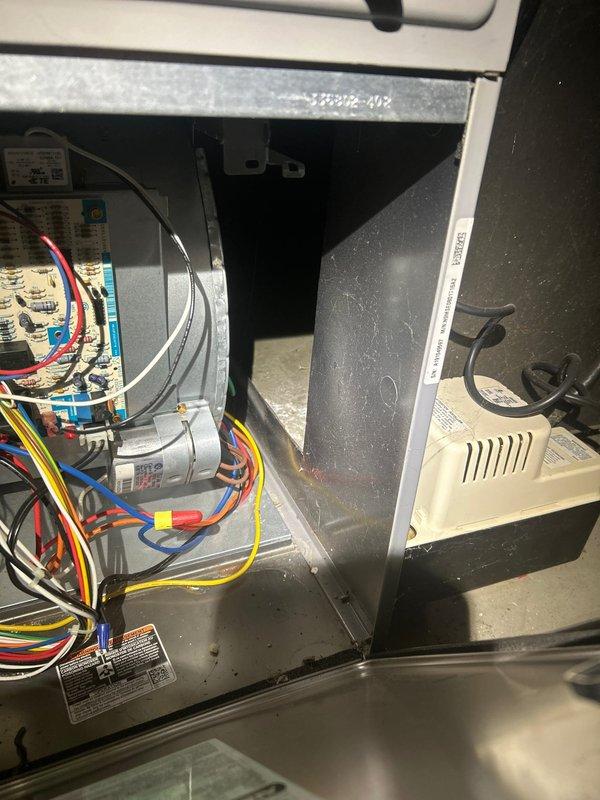Responded to no cooling complaint on residential HVAC system. Upon arrival, performed comprehensive system diagnostics including visual inspection of indoor air handler unit in basement and outdoor condensing unit. Tested dual run capacitor on outdoor unit using digital multimeter, verifying electrical values and component functionality. Inspected blower motor wiring, control board connections, and all electrical components within air handler cabinet. Evaluated contactor operation and checked all wire terminations for proper connections. System assessed for mechanical and electrical failures contributing to loss of cooling operation.