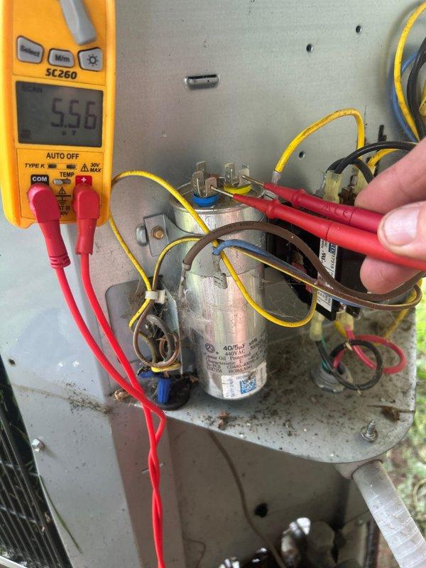 Responded to no cooling complaint on residential HVAC system. Upon arrival, performed comprehensive system diagnostics including visual inspection of indoor air handler unit in basement and outdoor condensing unit. Tested dual run capacitor on outdoor unit using digital multimeter, verifying electrical values and component functionality. Inspected blower motor wiring, control board connections, and all electrical components within air handler cabinet. Evaluated contactor operation and checked all wire terminations for proper connections. System assessed for mechanical and electrical failures contributing to loss of cooling operation.