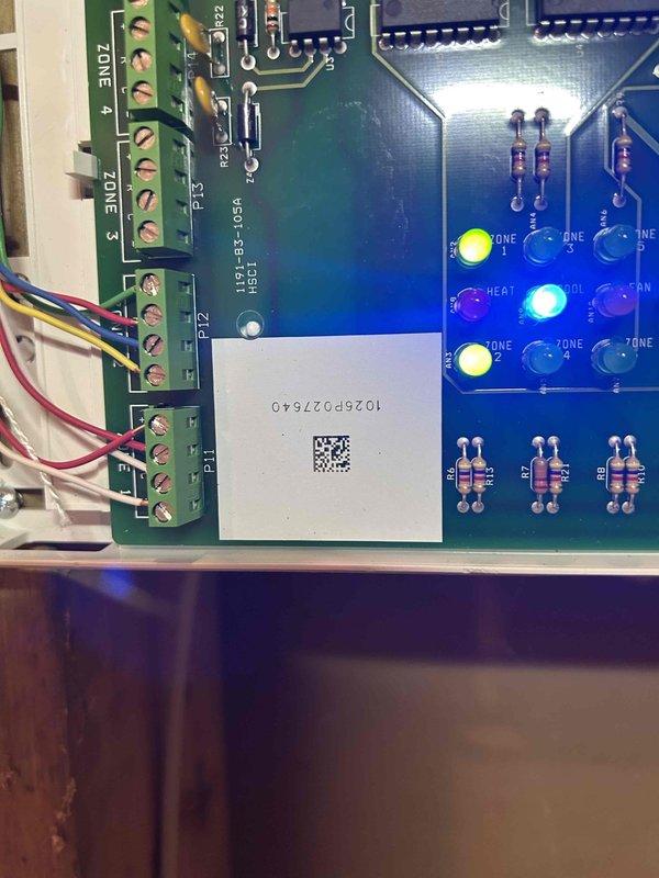 Installed Intellazone 2-24v zoning control system and replaced two existing thermostats with TPCC32U03WWAP color touchscreen models to enable multi-zone temperature control. Completed all electrical wiring connections to the control board terminal blocks for zone management, programmed the system for proper zone operation, and verified all LED indicators and zone functions were operational. Installation required approximately three hours to mount equipment, run wiring, configure system parameters, and test zone switching capabilities.