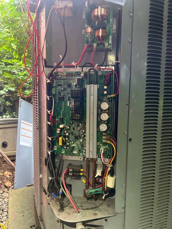 Responded to no cooling call for dual-zone electric HVAC system with 5-year-old equipment. Customer reported both upstairs and downstairs systems were not operating and not communicating with each other. Upon arrival, performed diagnostic evaluation of outdoor condensing unit and accessed electrical control panel to inspect internal components, circuit boards, transformers, capacitors, and wiring connections. Documented system condition with photos showing control board configuration, power distribution components, and overall electrical assembly. Customer had replaced filters prior to service call. Further diagnostics required to determine communication failure between zones and restore cooling operation to both systems.