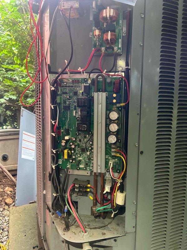 Responded to no cooling call for dual-zone electric HVAC system with 5-year-old equipment. Customer reported both upstairs and downstairs systems were not operating and not communicating with each other. Upon arrival, performed diagnostic evaluation of outdoor condensing unit and accessed electrical control panel to inspect internal components, circuit boards, transformers, capacitors, and wiring connections. Documented system condition with photos showing control board configuration, power distribution components, and overall electrical assembly. Customer had replaced filters prior to service call. Further diagnostics required to determine communication failure between zones and restore cooling operation to both systems.