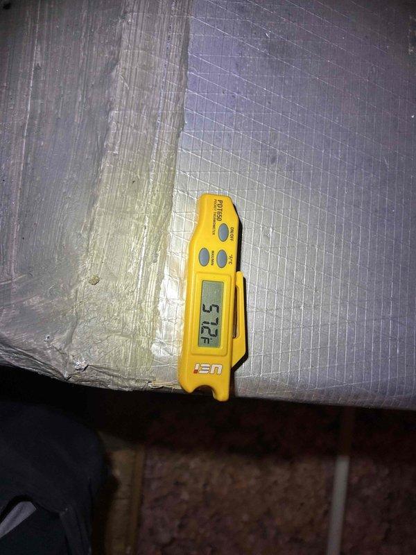 Responded to callback for insufficient cooling on second floor with 11-degree temperature differential between setpoint and actual reading. Performed diagnostic evaluation of upstairs HVAC system. Inspected supply air temperatures at register, measuring 32.5°F at ductwork, indicating adequate cooling capacity from equipment. Examined air distribution system including ductwork insulation and supply vents. Found evidence of condensation staining on duct insulation material and dust accumulation on supply registers, suggesting potential airflow restrictions or distribution issues affecting system performance.