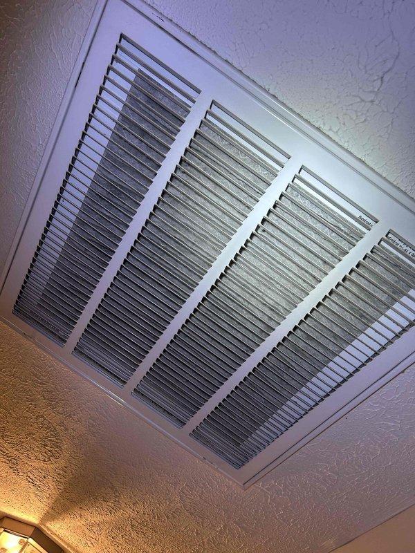 Responded to callback for insufficient cooling on second floor with 11-degree temperature differential between setpoint and actual reading. Performed diagnostic evaluation of upstairs HVAC system. Inspected supply air temperatures at register, measuring 32.5°F at ductwork, indicating adequate cooling capacity from equipment. Examined air distribution system including ductwork insulation and supply vents. Found evidence of condensation staining on duct insulation material and dust accumulation on supply registers, suggesting potential airflow restrictions or distribution issues affecting system performance.