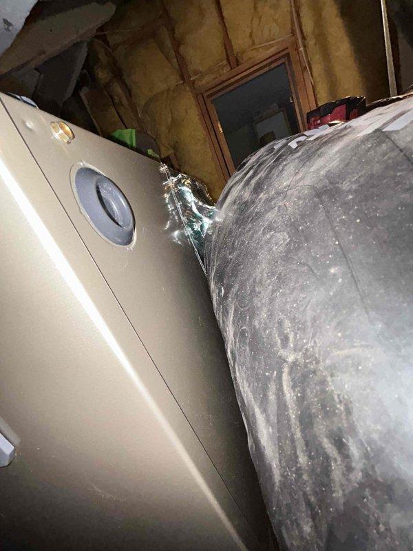 Responded to emergency callback following previous day's AC unit replacement installation. Upon arrival, found significant water damage with ceiling collapse and active water dripping from attic-mounted air handler onto bedroom floor. Investigation revealed condensate drain line failure causing overflow from drain pan. Documented extensive ceiling damage and water intrusion affecting insulation and drywall. Cleared condensate blockage, verified proper drainage, and confirmed air handler operation. Advised customer that structural repairs to ceiling and water damage remediation would be required beyond HVAC scope of work.