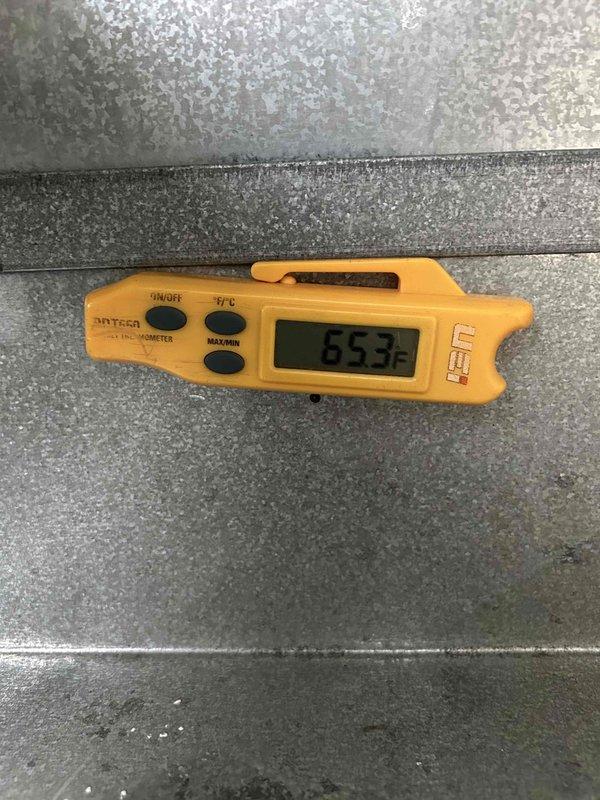 Responded to no cooling complaint on downstairs 4-year-old electric air conditioning unit. Upon arrival, found condensate drain system equipped with safety float switch had triggered, shutting down the system due to blocked drain line. Verified upstairs unit operating normally. Cleared condensate drain blockage and reset safety switch. Measured supply air temperature at 55.3°F, confirming proper cooling operation restored. Unit returned to normal operation with adequate airflow and temperature differential.