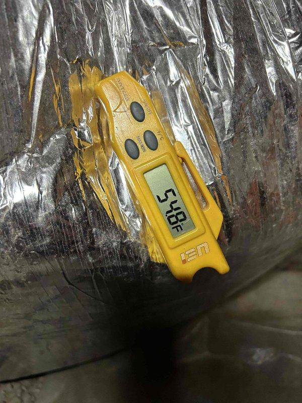 Responded to a second opinion request for a gas furnace/air conditioning system with no cooling issue. Performed diagnostic testing using clamp meter showing low amperage reading of 0.56A at outdoor unit, indicating potential compressor or electrical failure. Measured supply air temperature at 54°F at insulated ductwork, confirming inadequate cooling performance and validating customer concern regarding system operation.
