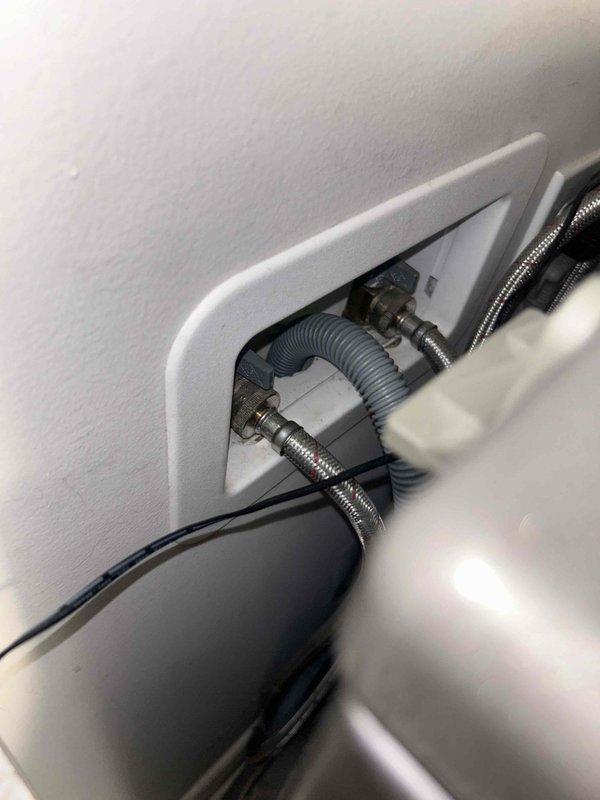 Responded to service call for kitchen sink with garbage disposal backing up. Performed complimentary whole home plumbing inspection as requested. Inspected double-basin kitchen sink with garbage disposal unit installed in left basin. Examined disposal operation, drain assembly, and P-trap configuration. Assessed water supply connections and drain lines behind adjacent appliances to verify proper venting and drainage flow. System evaluated for blockages, improper installation, or mechanical failure of disposal unit.
