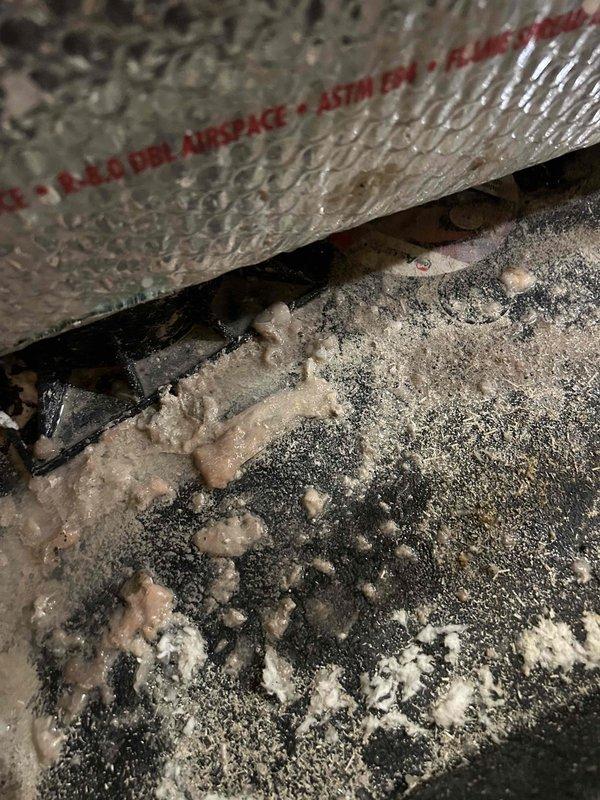 Responded to service call for 9-year-old air conditioning system that had shut down due to clogged condensate drain line causing water to accumulate in the secondary drain pan. Cleared blockage from primary drain line, removed debris and buildup, flushed drain system to restore proper flow, and verified water was draining correctly. Inspected evaporator coil area and found significant dust and debris accumulation on surrounding components. Tested system operation after drain repair, confirmed unit cooling properly with thermostat set to 73°F and displaying 76°F current temperature in active cooling mode. System restored to normal operation with no water overflow risk.