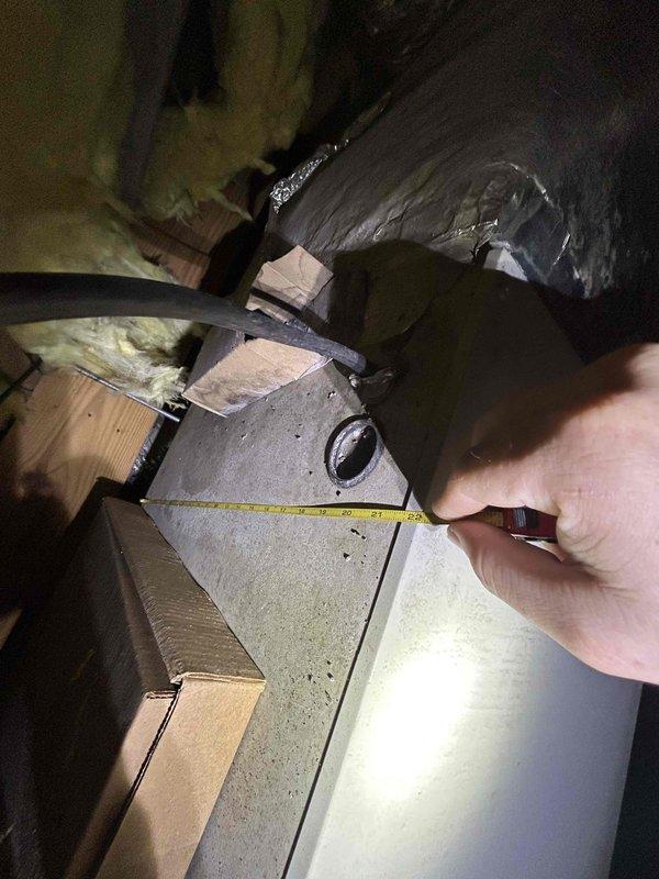 Responded to service call for HVAC system evaluation and quote preparation. Performed comprehensive inspection of existing system including attic-mounted ductwork and plenum assembly, taking measurements of supply trunk and transitions. Assessed evaporator coil condition and blower assembly in mechanical room. Documented equipment specifications, duct sizing, and component conditions through detailed measurements and photography to provide accurate repair versus replacement cost analysis for customer decision-making.