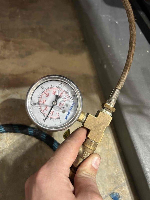 Completed annual maintenance visit on geothermal heating system as part of 10-year care plan. Performed comprehensive system inspection including pressure testing of refrigerant lines using calibrated gauges, verified proper operation of Geo-Flo circulation pump, and inspected flow control valve assembly with interlock controls for proper functionality. All components operating within normal parameters. Documented system conditions with detailed photographs per buyer's request for property transfer records. Retrieved previously left equipment from site.