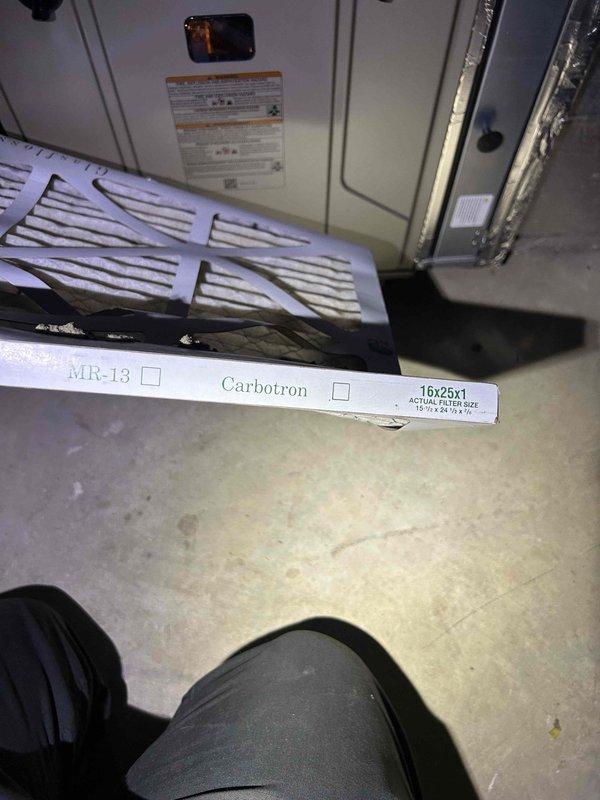 Completed HVAC maintenance inspection on air conditioning system. Measured supply air temperature at 58.4°F at ceiling register, checked system operation, and verified proper airflow through ventilation grille. Inspected air handler unit and confirmed 16x25x1 MR-13 Carbotron filter was in place and serviceable.