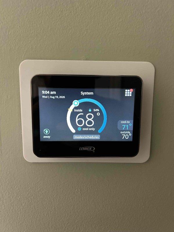 Completed scheduled maintenance tune-up on heat pump system including outdoor condenser unit and indoor air handler. Performed comprehensive inspection of outdoor unit showing normal weathering and operational wear, verified condenser coil condition and proper airflow through ventilation grilles. Installed new 16x25x1 air filter per updated specifications. Verified Lennox thermostat programming and functionality, confirmed system operating in cooling mode with indoor temperature at 68°F and set point of 71°F, humidity reading 54%. All components inspected and found operating within normal parameters.
