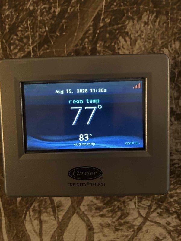 Diagnosed faulty outdoor control board on Carrier Infinity system and quoted replacement repair. Board requires ordering with 2-3 day lead time as part is not available in local Lexington stock. Documented existing thermostat operation showing system actively cooling and captured internal control panel wiring configuration for reference during upcoming board replacement.
