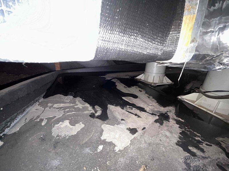 Responded to no cooling complaint on 4-year-old AC system with inadequate airflow from vents. Upon inspection, discovered severely restricted airflow due to collapsed or disconnected ductwork in crawlspace, evidenced by minimal air delivery and barely cool temperatures throughout home. Located damaged flexible ductwork beneath structure showing separation from supply plenum, along with contaminated crawlspace conditions including moisture staining on concrete floor. Inspected indoor air handler unit and found electric heat strips and coil assembly intact but unable to deliver conditioned air effectively due to compromised duct system. Documented ductwork damage and crawlspace conditions with photos for repair estimate. Advised immediate duct repair required to restore proper airflow and system cooling capacity.
