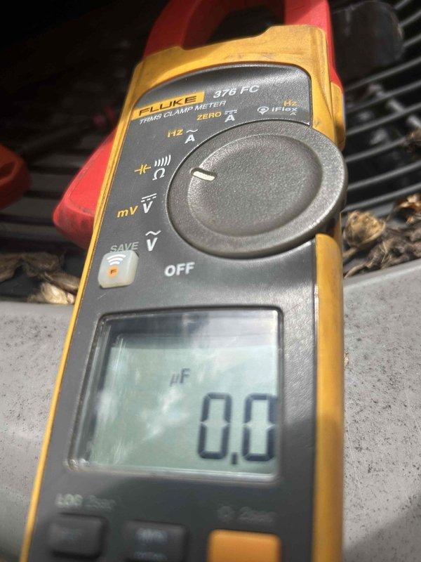 Responded to a no cooling complaint on a 5-year-old heat pump system with thermostat set to 66°F but reading 70°F. Performed diagnostic testing using digital thermometer at supply register, measuring 75.4°F discharge air temperature, and utilized clamp meter to check electrical readings on the outdoor unit. System was not maintaining adequate temperature differential, indicating insufficient cooling capacity.