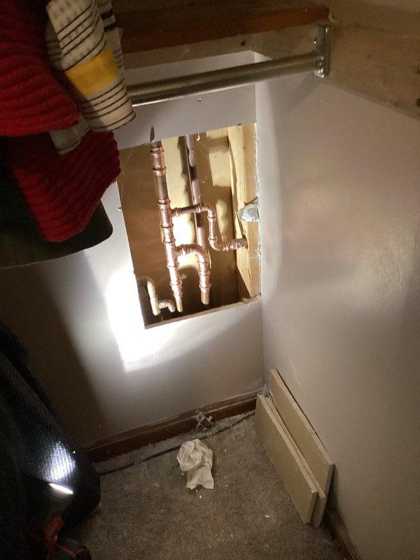 Responded to customer report of outdoor spigot not shutting off completely and unusually high water bill indicating possible leak. Accessed plumbing system through interior wall cavity to locate and repair malfunctioning outdoor spigot valve assembly. Cut access panel in interior wall to reach copper supply lines connected to exterior hose bib. Identified failed valve seat and internal components preventing complete water shutoff. Replaced defective valve mechanism and tested system to ensure proper shutoff function and eliminate leak. Restored water control to outdoor spigot, resolving high water consumption issue.