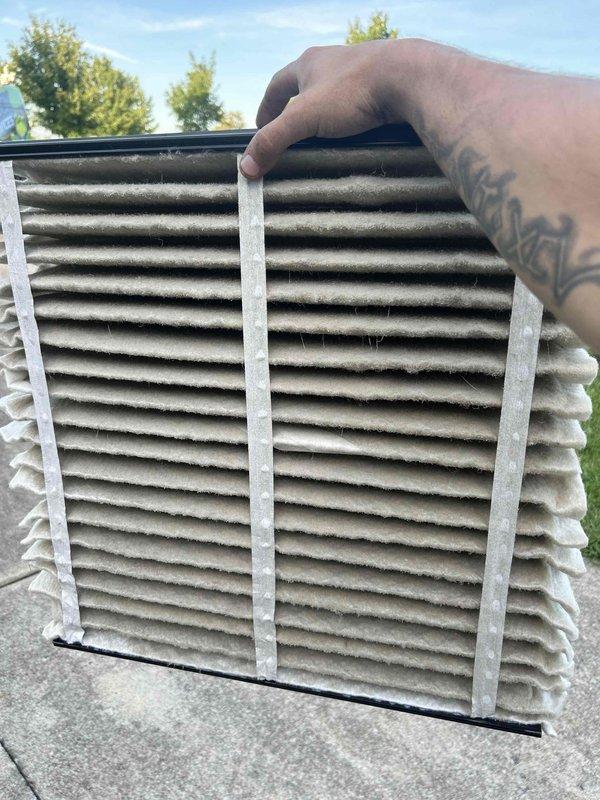 Responded to service call back for upstairs HVAC system not maintaining temperature setpoint, with unit reading 77°F while set to 72°F. Upon inspection, found heavily soiled air filter with significant dust and debris accumulation restricting airflow. Replaced dirty filter and performed system diagnostics using refrigerant manifold gauge to verify operating pressures and temperatures. Confirmed system is now cooling properly with adequate airflow and proper refrigerant charge levels.