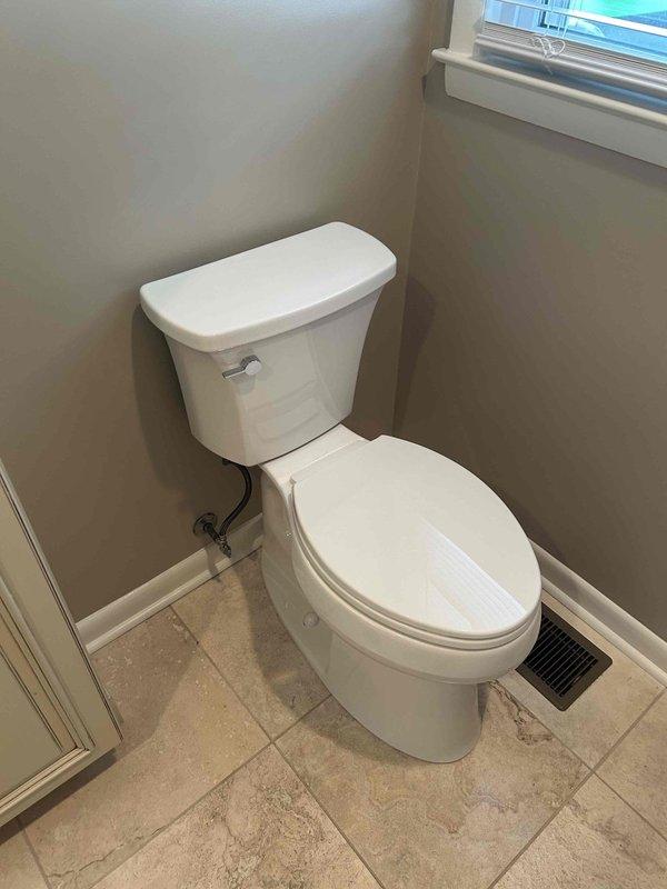 Removed two existing toilets and installed two new Kohler ADA-compliant handicap height toilets in separate bathroom locations. Both units were staged from warehouse inventory prior to installation. All installations included new wax rings, supply line connections, floor mounting hardware, and leak testing to ensure proper operation and sealing.