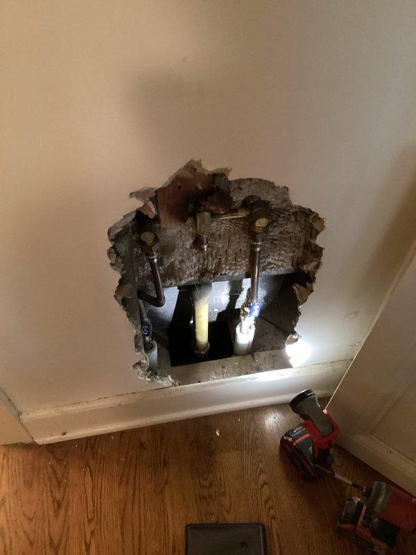 Responded to a persistent drain clog that required accessing the plumbing system through the interior wall. Cut an access hole in the drywall near floor level to reach the affected drain line based on previous diagnostic findings. Successfully cleared the obstruction from the drain system. Additionally inspected and addressed a malfunctioning sump pump that was producing excessive noise during operation.