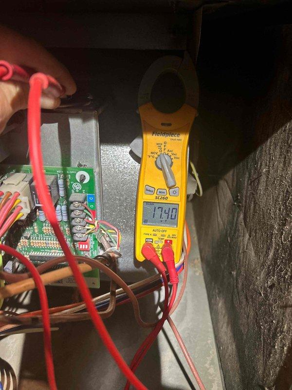 Performed comprehensive pre-purchase HVAC system inspection at property. Conducted visual assessment of air handler unit, noting absence of condensate overflow safety switch on equipment. Evaluated ductwork connections, flex duct installation, and associated plumbing components for proper installation and condition. Performed electrical diagnostics using clamp meter, recording amperage draw of 17.40 amps on system components. Inspected control board, relay components, and electrical connections within control panel for proper operation. Documented equipment condition, installation quality, and operational parameters with photos for buyer's records.