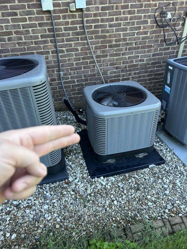 Completed planned maintenance visit on three-system heat pump configuration with air handlers located in attic and basement areas. Performed comprehensive tune-up procedures on all three units including inspection of outdoor condensers positioned on exterior gravel pad, verification of electrical connections and disconnect boxes, and testing of system performance parameters. Evaluated UV air purification system (Fresh Aire APCO in-duct PCO technology) integrated with ductwork, confirmed proper operation and recorded diagnostic readings showing temperature measurement of 56 degrees at supply duct. Inspected insulated ductwork for integrity and airflow efficiency. Customer provided upstairs filters as specified (three 16x20x1 filters). All three heat pump systems operational and functioning within manufacturer specifications upon completion of maintenance protocol.
