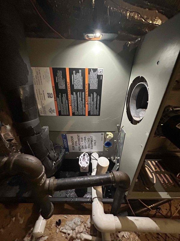 Replaced evaporator coil under warranty on attic-mounted HVAC system. Previously reclaimed refrigerant was recycled back into the unit from clean storage tank to prevent further loss during repair. Documented new coil model and serial number information for warranty claim processing and retrieved loaner window units from property.