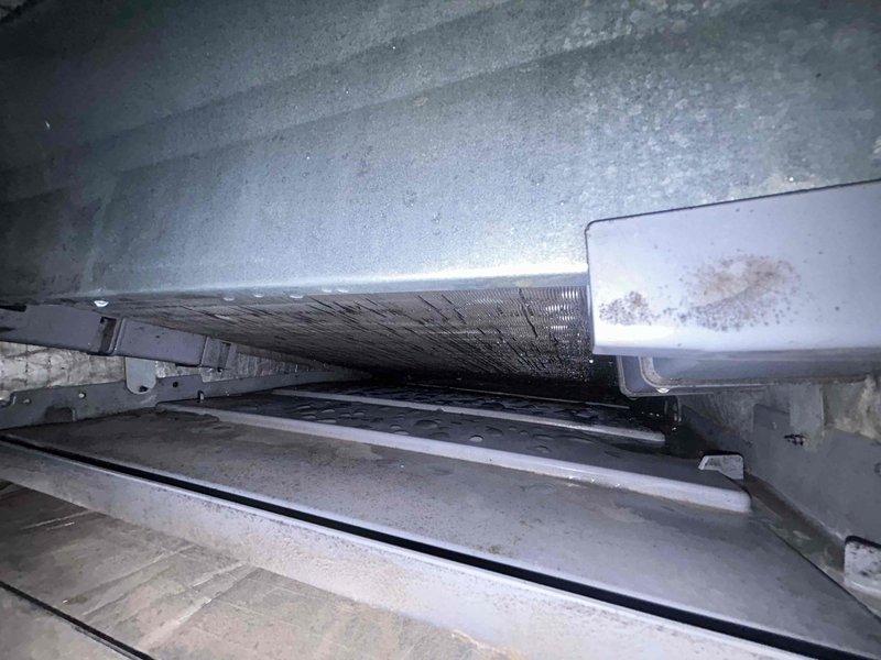 Responded to no cooling complaint on 3-year-old mini-split system experiencing freeze-up condition. Upon inspection, discovered severely clogged evaporator coil with heavy dust and debris accumulation restricting airflow, which was causing the coil to ice over and preventing proper heat exchange. Cleaned evaporator coil thoroughly, removed accumulated contaminants, and verified system operation. Recommended regular filter maintenance and periodic coil cleaning to prevent recurrence of airflow restriction issues.