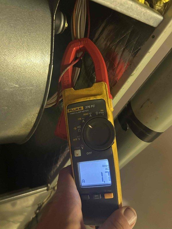 Completed annual preventive maintenance tune-up on heat pump system with air handler located in basement. Performed comprehensive system diagnostics including temperature differential measurements across coils registering 57.5°F and electrical current draw testing using clamp meter to verify proper compressor and fan motor operation. Installed billable 18x20x1 air filter as requested, inspected all electrical connections, and confirmed system operating within manufacturer specifications.