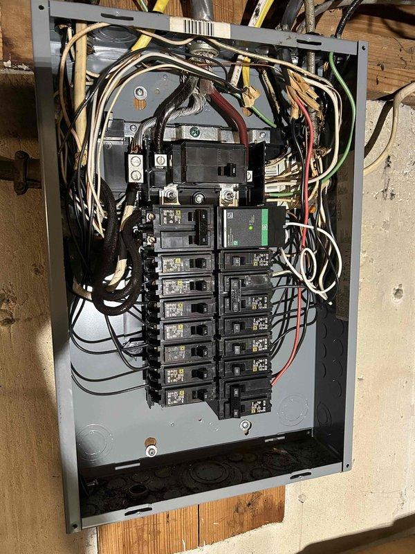 Replaced the main circuit breaker in the electrical service panel and installed a new whole-home surge protection device to safeguard the residence from voltage spikes and power surges. Verified proper voltage readings of 244.5V using a digital clamp meter and ensured all circuit breaker connections were secure and functioning correctly within the panel box.