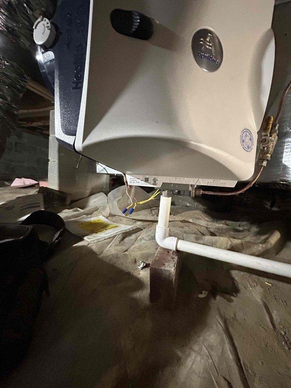 Completed full residential dual fuel HVAC system installation on first floor, including Lennox 66K BTU 96% efficiency gas furnace (model ML196UH070XE36BK), Lennox 2-ton 17 SEER2 heat pump (model ML14KP1-024-230), and matching evaporator coil (model CK40HT-24B-71). Installed Aprilaire 620M bypass humidifier for whole-home humidity control up to 4,000 square feet and REME Halo LED air purification system for enhanced indoor air quality. Set new digital thermostat and established proper communication between dual fuel components. Installed 36x36 outdoor unit pad for heat pump placement. Ran copper refrigerant lines, gas supply piping, and white PVC condensate drainage with proper pitch and termination. Made all electrical connections including low voltage control wiring and high voltage power supply. Secured all ductwork connections to existing distribution system with proper sealing. Installed condensate drain pan beneath indoor unit in attic space with emergency overflow protection. Obt