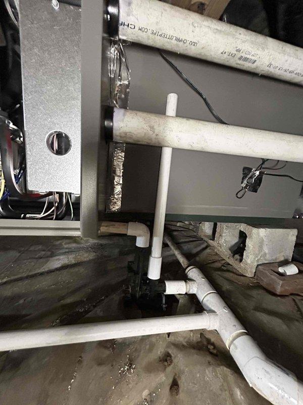 Completed full residential dual fuel HVAC system installation on first floor, including Lennox 66K BTU 96% efficiency gas furnace (model ML196UH070XE36BK), Lennox 2-ton 17 SEER2 heat pump (model ML14KP1-024-230), and matching evaporator coil (model CK40HT-24B-71). Installed Aprilaire 620M bypass humidifier for whole-home humidity control up to 4,000 square feet and REME Halo LED air purification system for enhanced indoor air quality. Set new digital thermostat and established proper communication between dual fuel components. Installed 36x36 outdoor unit pad for heat pump placement. Ran copper refrigerant lines, gas supply piping, and white PVC condensate drainage with proper pitch and termination. Made all electrical connections including low voltage control wiring and high voltage power supply. Secured all ductwork connections to existing distribution system with proper sealing. Installed condensate drain pan beneath indoor unit in attic space with emergency overflow protection. Obt