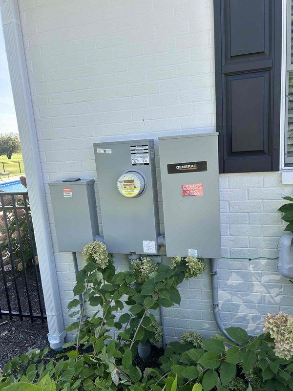 Completed preventive maintenance on residential Generac standby generator system. Performed visual inspection of generator unit, transfer switch, and associated electrical connections mounted on exterior of residence. Documented equipment installation with photographs showing generator transfer switch, electric meter, and service disconnect panels. All components found to be properly secured and accessible. Applied service stickers to unit per new customer protocol.
