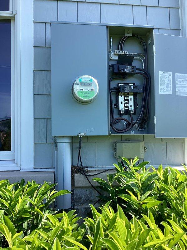 Completed comprehensive electrical estimate for generator installation at residential property. Documented existing electrical infrastructure including main service panel with dual-row circuit breaker configuration, copper bus bar assembly, and exterior meter base with adjacent distribution panel. Assessed current electrical system capacity, panel conditions, and optimal integration points for proposed generator transfer switch and associated wiring requirements.