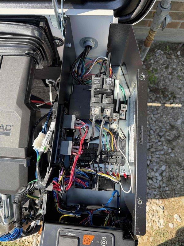 Completed installation of Generac 10KW standby generator system, replacing existing unit. Leveled area and installed reinforced concrete Genpad at generator location. Positioned and secured new generator unit (Model G0073210, Serial 3018801552) on pad and connected to existing natural gas supply line. Reused existing exterior conduit and junction box, pulling additional conductors to accommodate updated communication protocol between generator and transfer switch. Removed old transfer switch from laundry room and installed new unit in same location. Terminated all high voltage and low voltage control wiring at both generator and transfer switch ends, reusing existing junction box and branch circuits. Installed new battery in generator unit. Registered equipment with manufacturer and performed initial startup sequence. Conducted comprehensive system test verifying proper operation of automatic transfer switching, load transfer, and generator performance under simulated power outage cond
