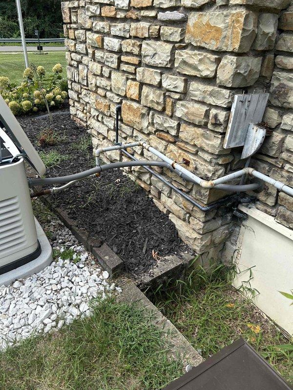 Completed scheduled maintenance on 24KW Generac EVO generator system. Performed standard inspection procedures, verified electrical connections at transfer switch panel and generator unit, and documented installation with required photographs of exterior electrical panel and generator location. All components found operational and properly secured.
